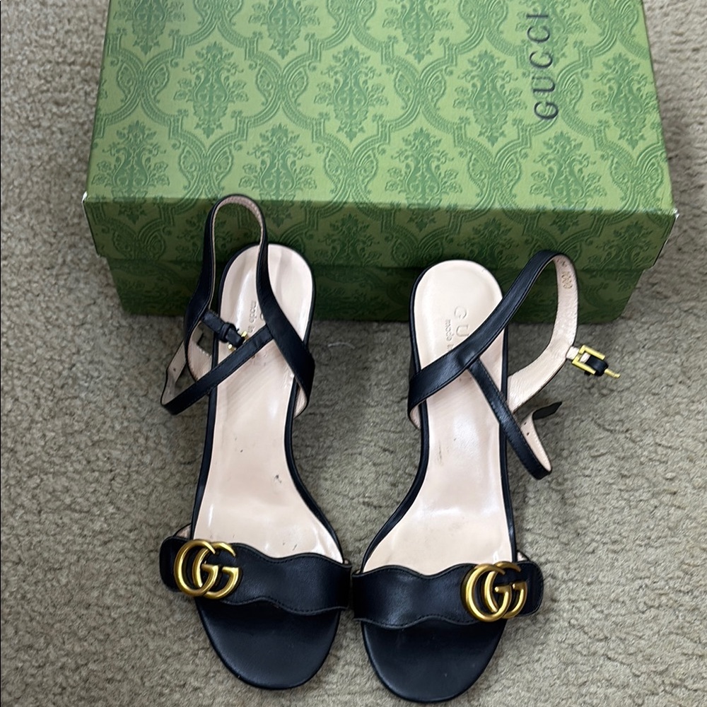 from Gucci outlet Women's Black Leather Sandals with Gold Accents authentic